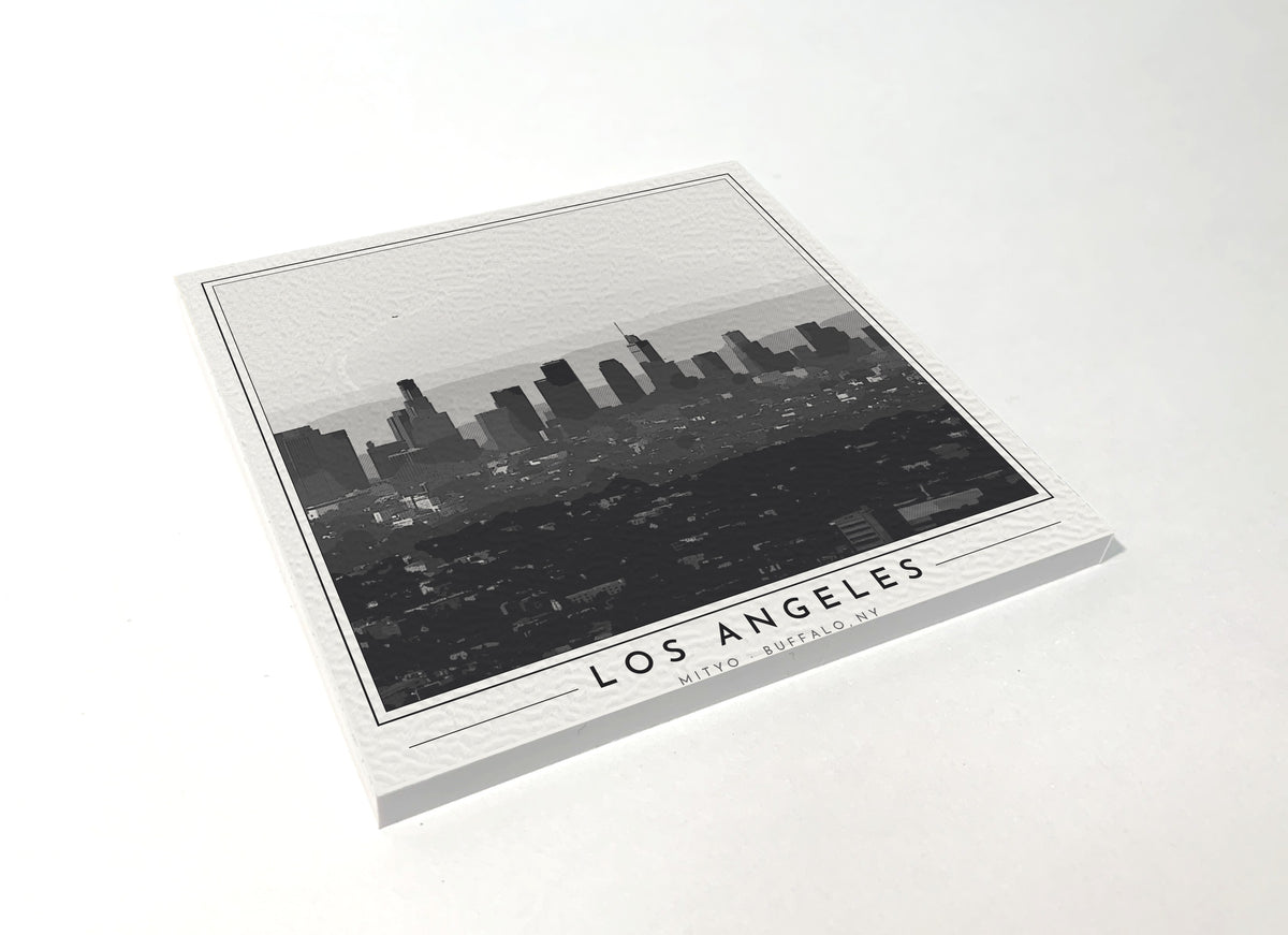 Square poster-style coaster of the downtown Los Angeles skyline, black-and-white