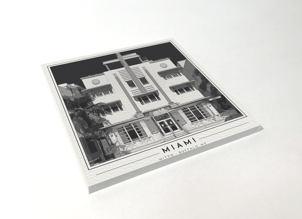 Square poster-style coaster of a pastel Art Deco hotel facade in South Beach, Miami Beach, black-and-white