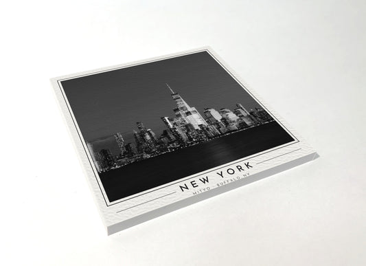 Square poster-style coaster of the Lower Manhattan skyline at night, black-and-white