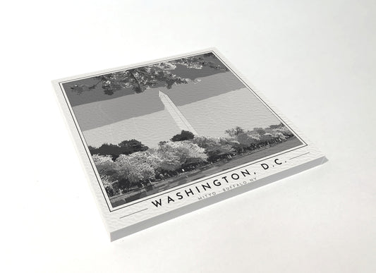 Square poster-style coaster of the Washington Monument framed by cherry blossoms, black-and-white